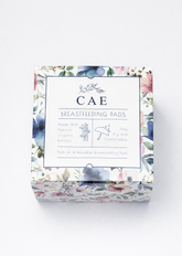 Pack of CAE reusable bamboo breastfeeding pads with floral design on a white background, 14 pack