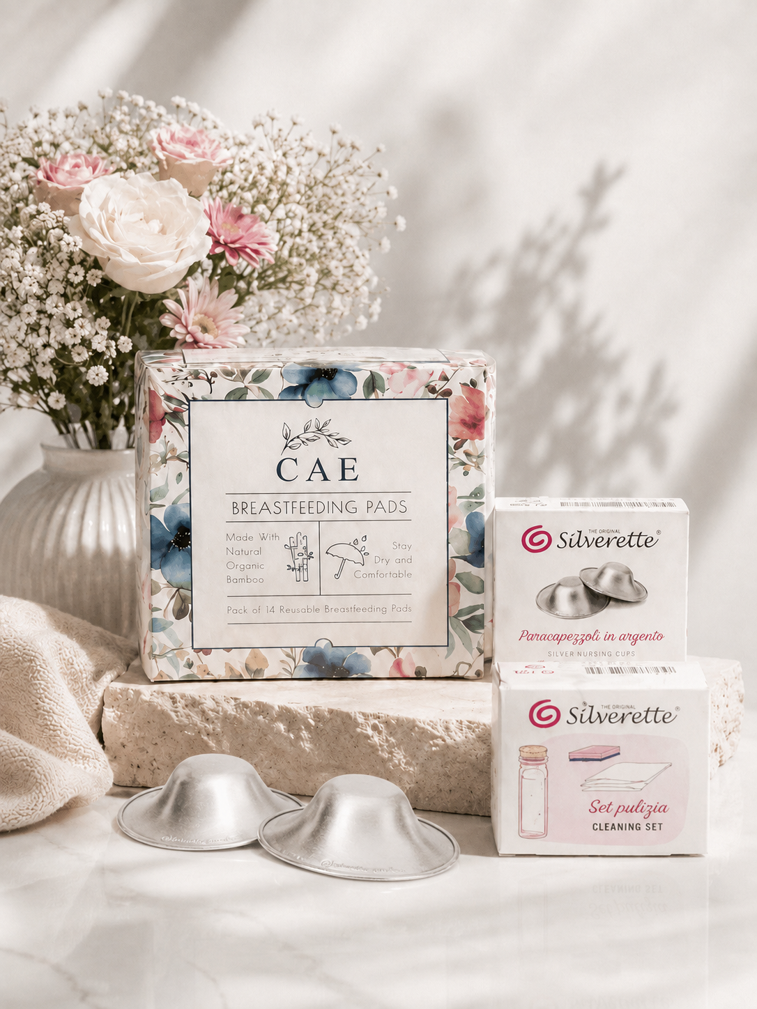 Silverette nursing essentials bundle with silver nipple shield and care accessories, designed for breastfeeding comfort and hygiene.