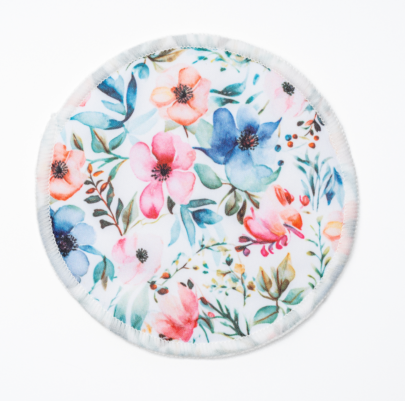 Floral printed outer layer of a CAE reusable bamboo nursing pad