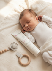 Sleeping baby next to Silverette Zinc Cream 100ml, a gentle nappy balm for sensitive skin